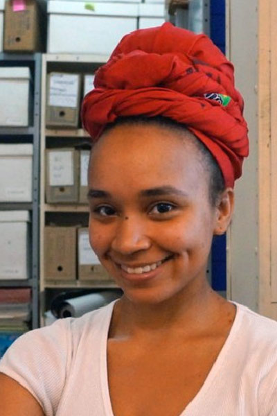 A smiling young lady in an office setting