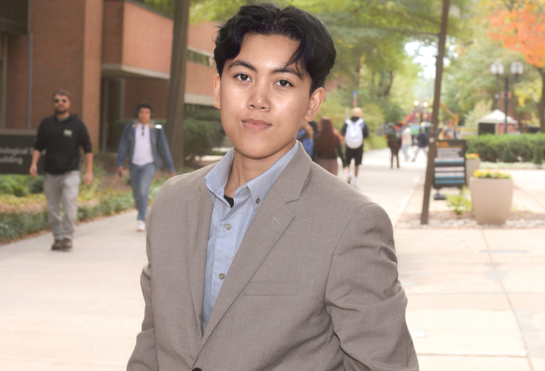 Thalia in business attire on UMBC campus