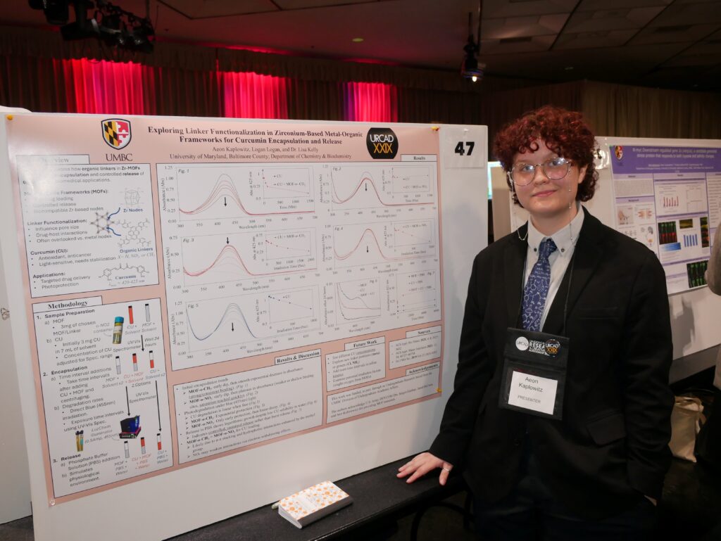 Aeon smiling and standing next to URCAD project